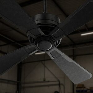 Close-up of a black industrial-style garage ceiling fan with four blades, installed in a modern garage.