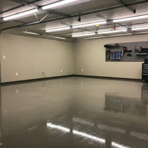 Modern garage with durable epoxy flooring, showcasing a popular garage flooring idea.
