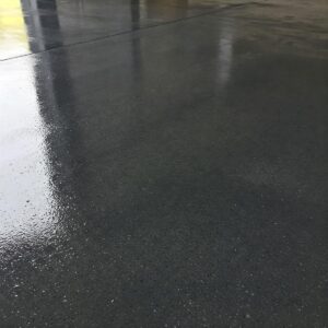  Image depicting a painted concrete garage floor with a protective sealant, a cost-effective flooring idea.