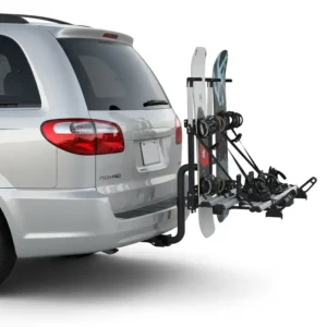 Snowboard hitch rack securely installed on a vehicle, ready for winter adventures.
