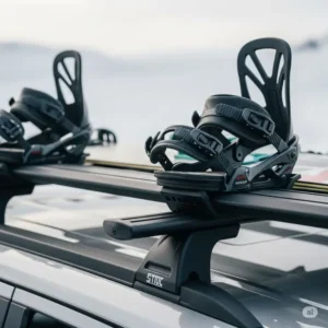  Detail of snowboard bindings firmly attached to a durable roof rack system.
