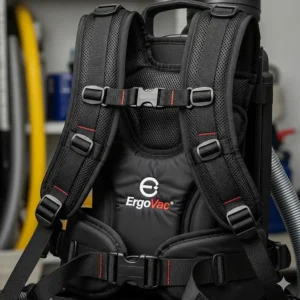 A close-up of the padded, adjustable harness on a commercial backpack vacuum designed for ergonomic comfort and reduced user fatigue.