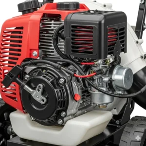 A detailed close-up shot of the engine on a gas-powered push leaf blower, highlighting the mechanical components and durable construction.