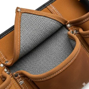 A detailed view of the interior lining of a leather electrician tool belt, showing the soft, moisture-wicking material that adds comfort during long workdays.