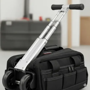 Close-up of a durable, telescopic handle on a portable tool bag roller, extended for easy transport.