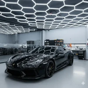 High-end honeycomb pattern hexagon LED lights for a professional detailing garage ceiling.