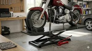 Professional-grade hydraulic motorcycle lift table with a front wheel chock for home maintenance.