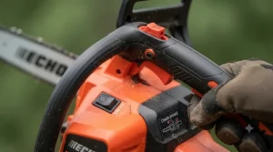 Close-up of safety brake and ergonomic trigger on electric top handle chainsaw