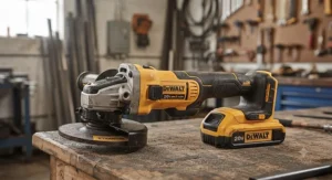 Close-up of a high-performance cordless angle grinder showing its lithium-ion battery and power switch.